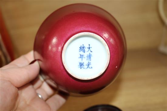 A Chinese ruby ground cup, wood stand Bowl 6.5cms H